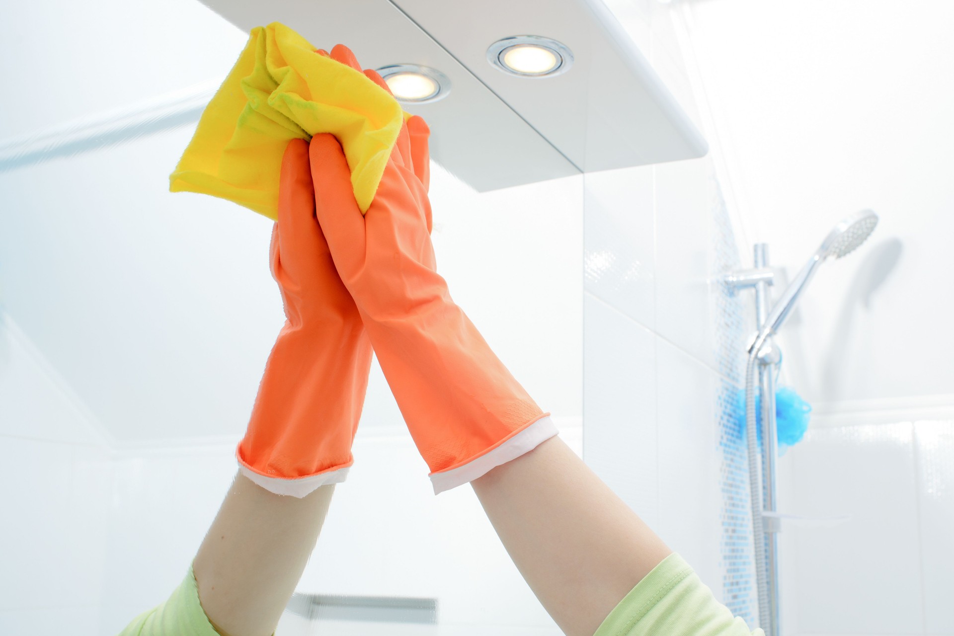 A woman cleaning bathroom at home